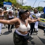 BREAKING NEWS: “OUR HUSBANDS ARE NOT GOING ANYWHERE!” — SOUTH AFRICAN ZULU WOMEN STAGE DRAMATIC ‘BRA PROTEST’ TO PROTECT NIGERIAN AND ZIMBABWEAN SPOUSES